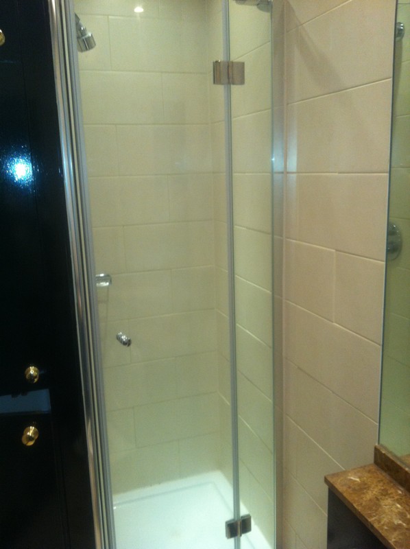 Frameless glass shower enclosure with chrome fittings in Hampstead