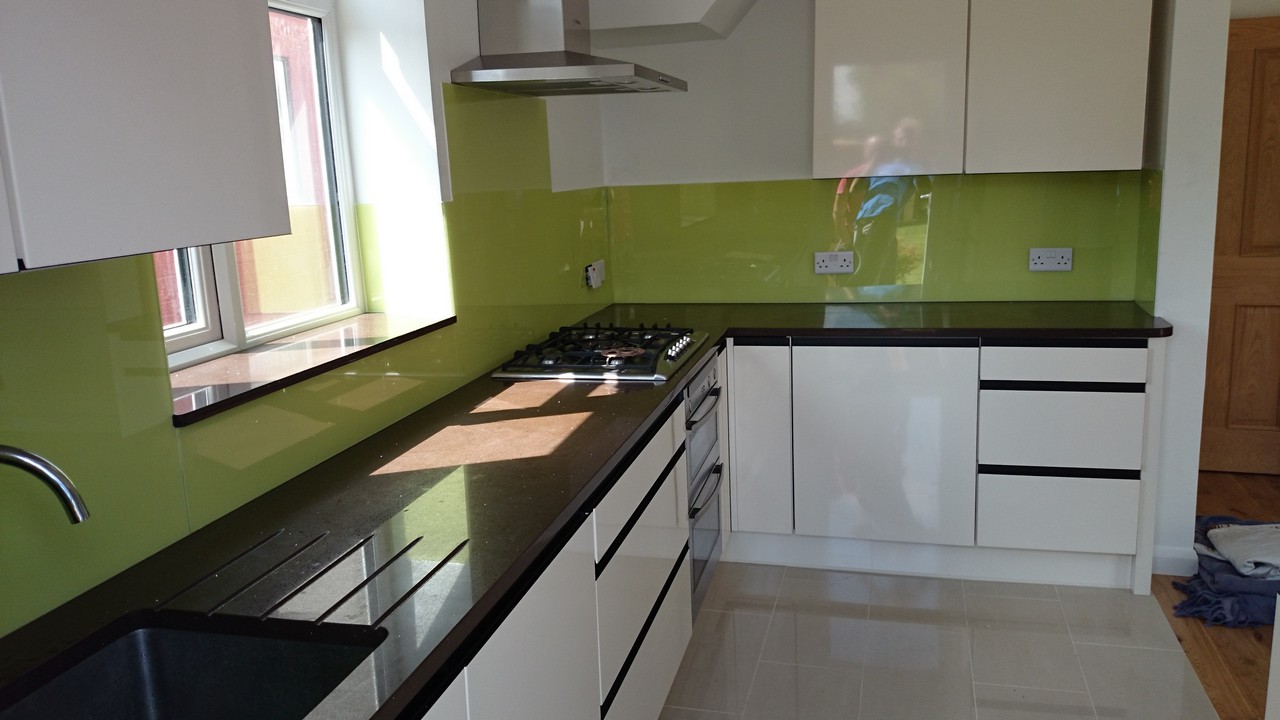 Lime green glass kitchen splashback installed by Hampstead glaziers