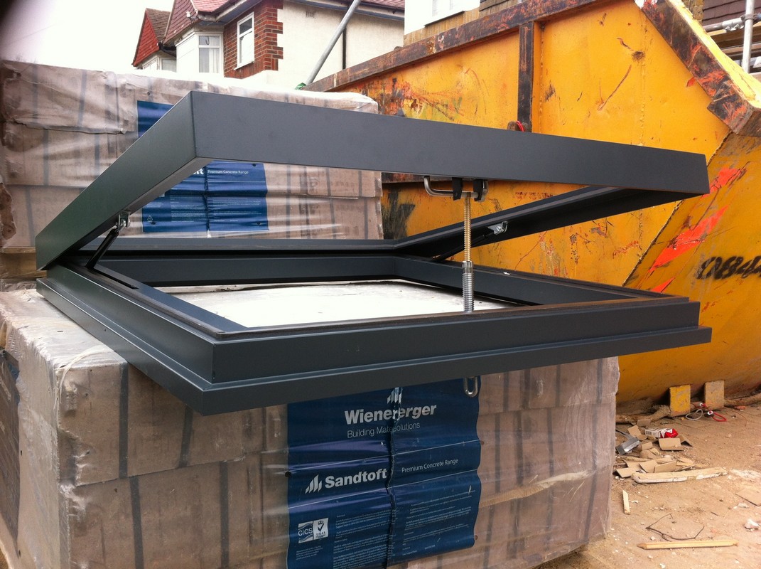Opening flat roof skylight in anthracite grey installed in Hampstead