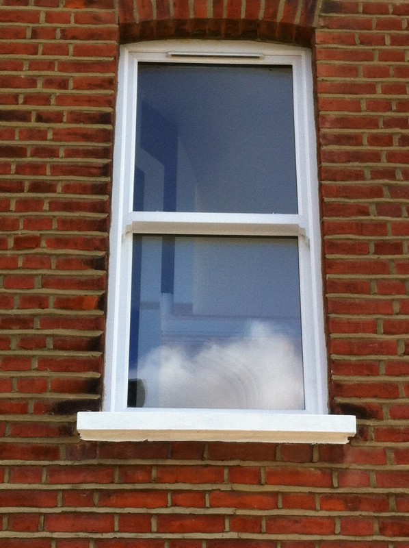 uPVC sash window on Victorian red brick house in Hampstead